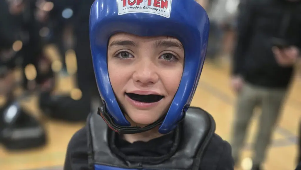 Young CTBA student smiling in headgear