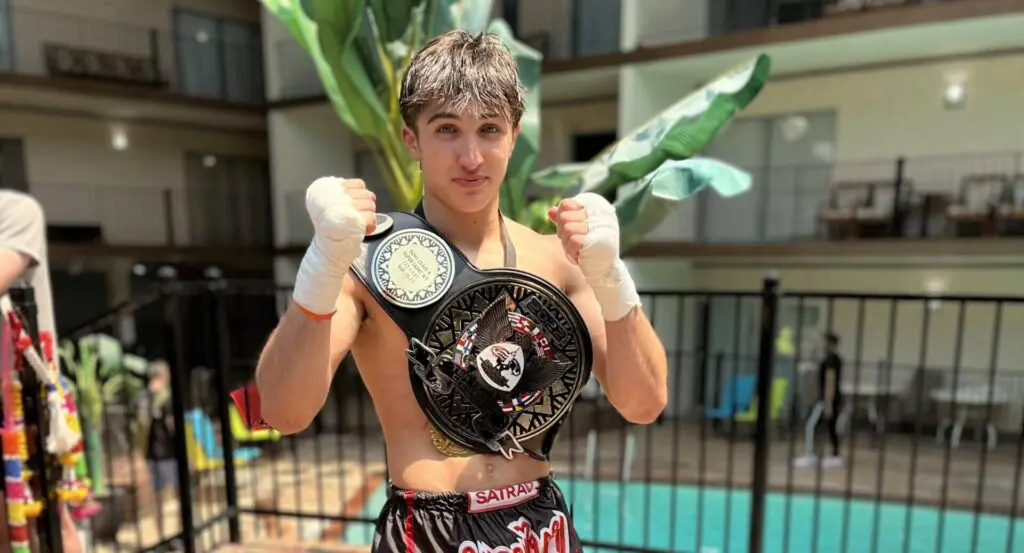 Young CTBA fighter with a championship belt